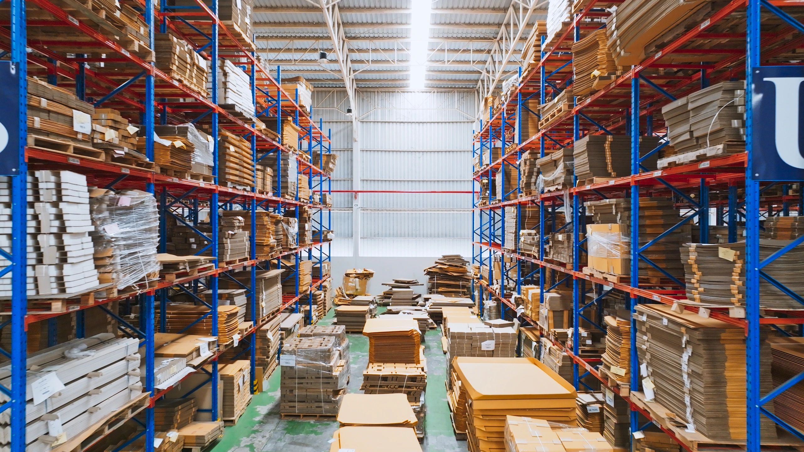 Warehouse inventory shelves with packaged goods
