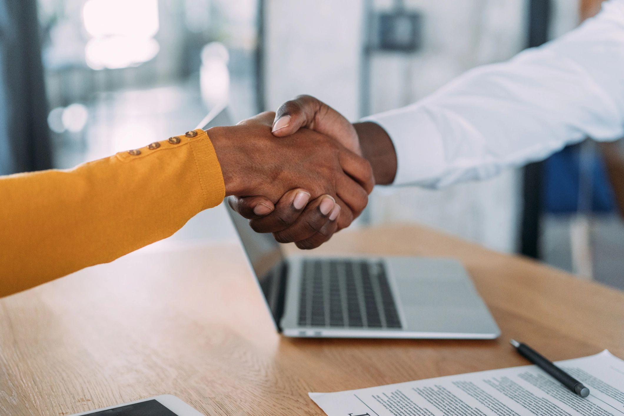 Business handshake after signing a contract